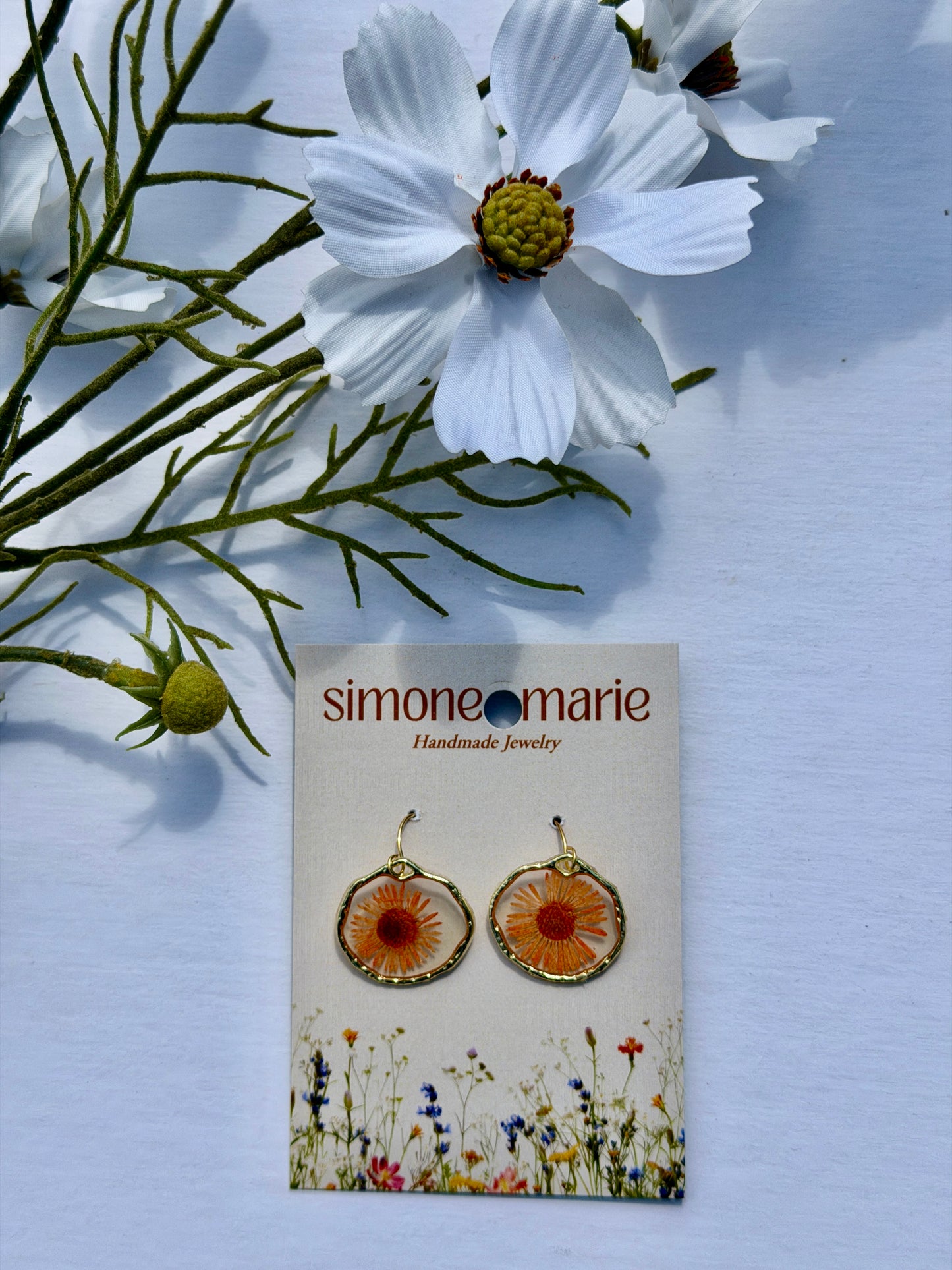 Orange flower in hammered bezel