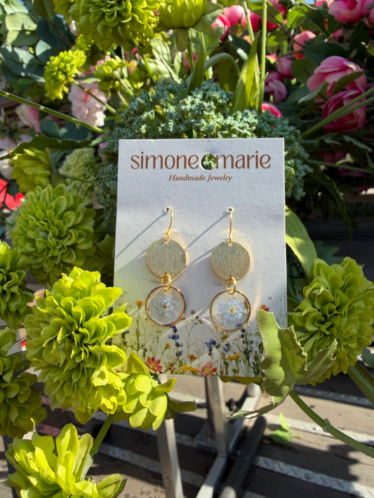 Blue forget me nots with hammered circle charm